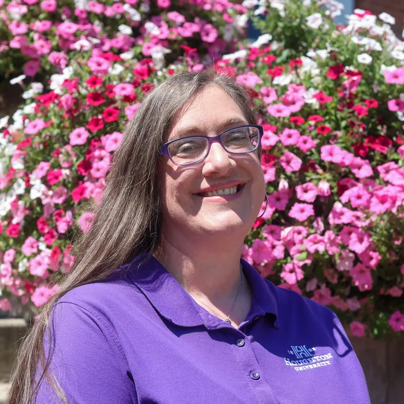 Amanda Zambrano outside near flowers