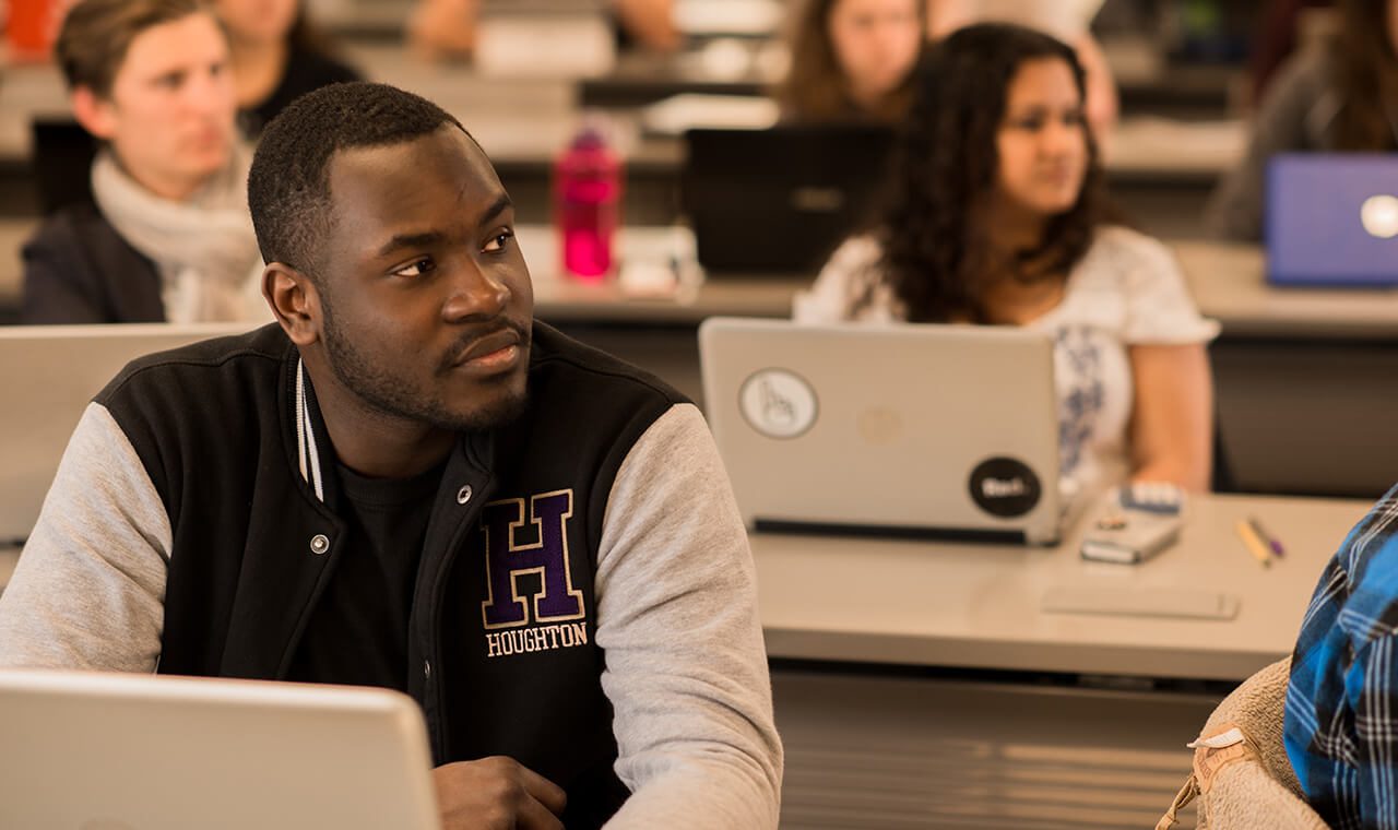 Houghton Universityaccounting student wearing ����ר�� jacket in business class.