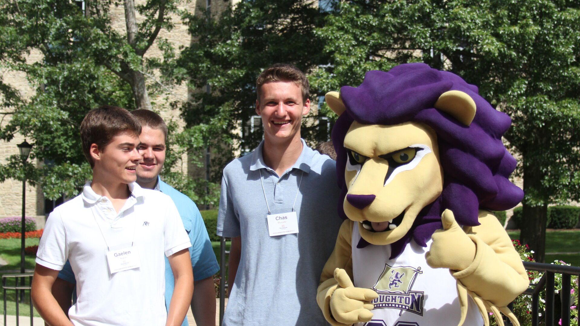 Highlander mascot Luckey posing with student for a photo