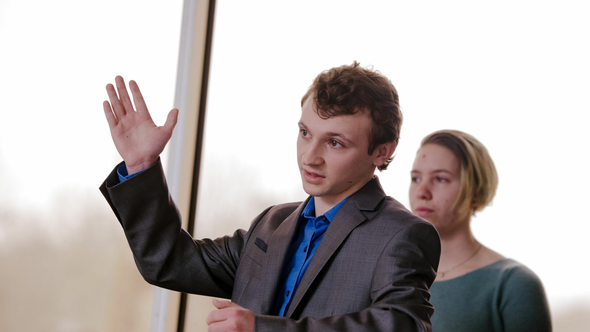 Houghton Universitystudent presenting in business class.
