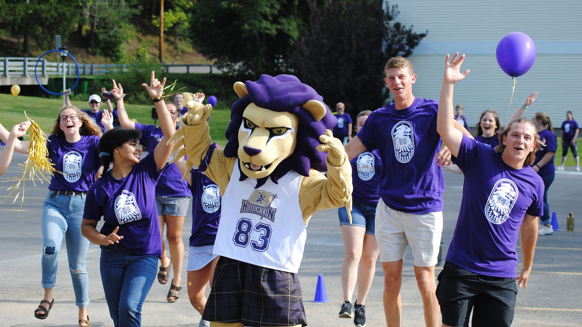 Students and mascot cheering during move-in day.