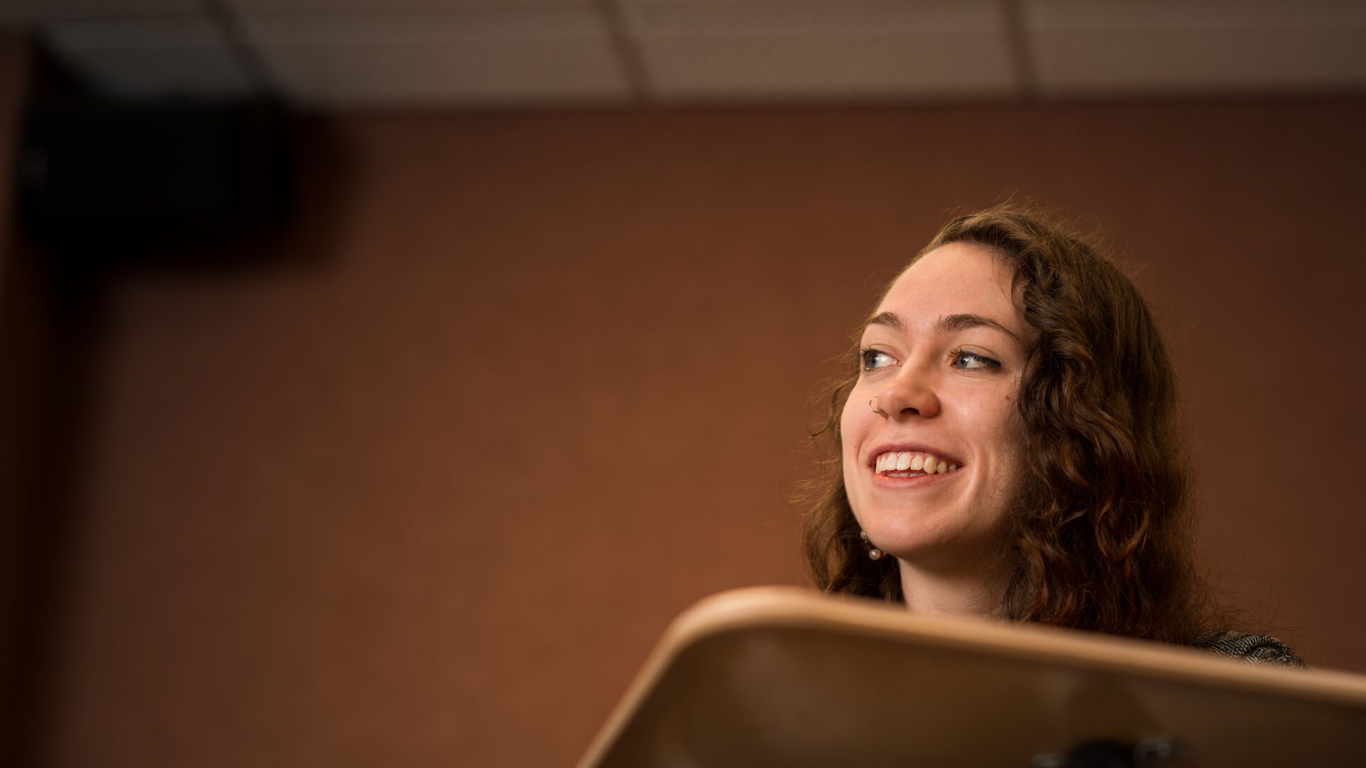 Student smiling in classroom