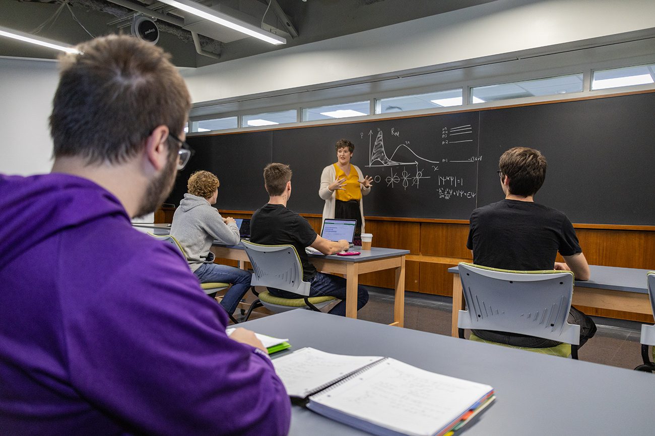 Houghton Universityprofessor Katrina Koehler speaking to physics class.