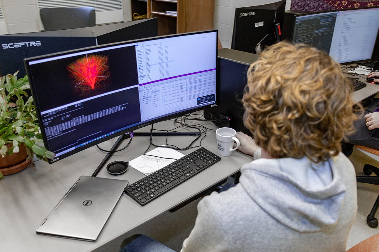 Houghton Universityphysics student working on computer in the computational lab.