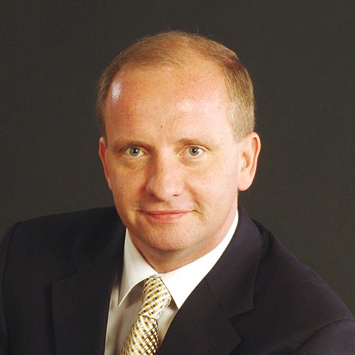 Theodore Kuchar with suit coat and tie.