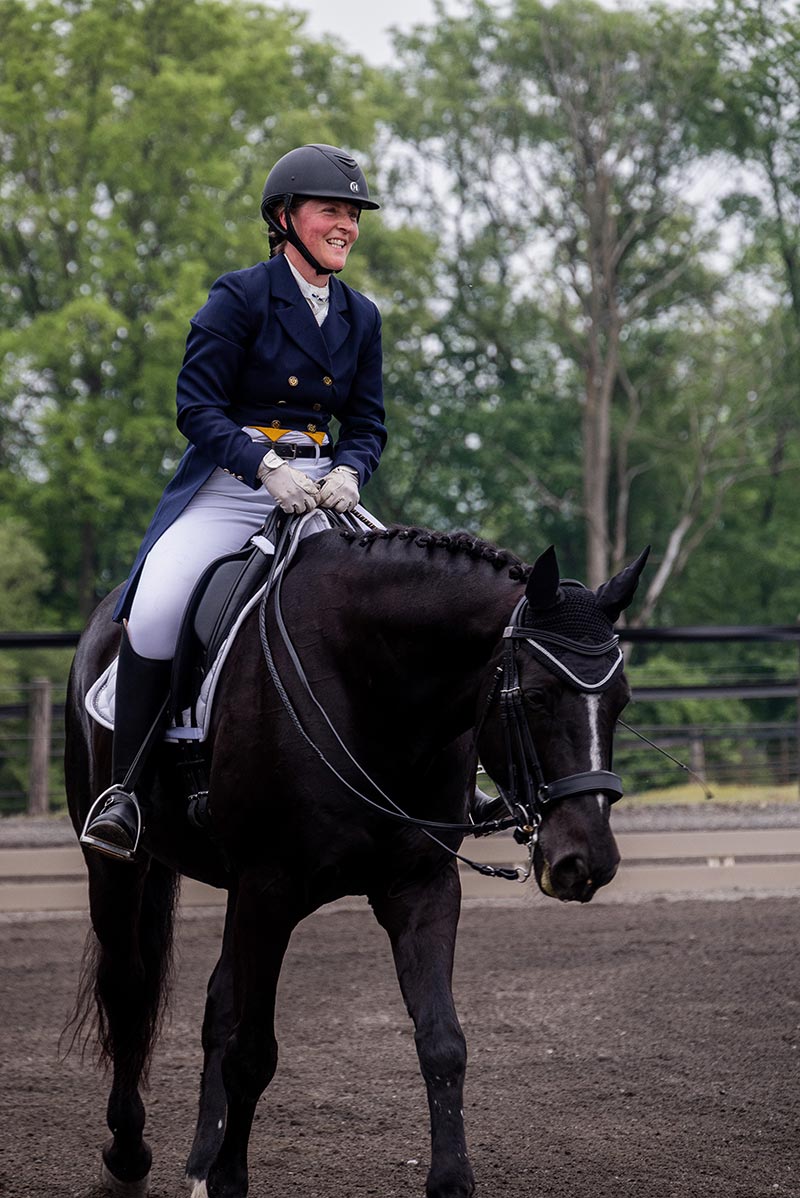 Houghton Universityprofessor Larissa Ries riding horse at Equestrian Center.