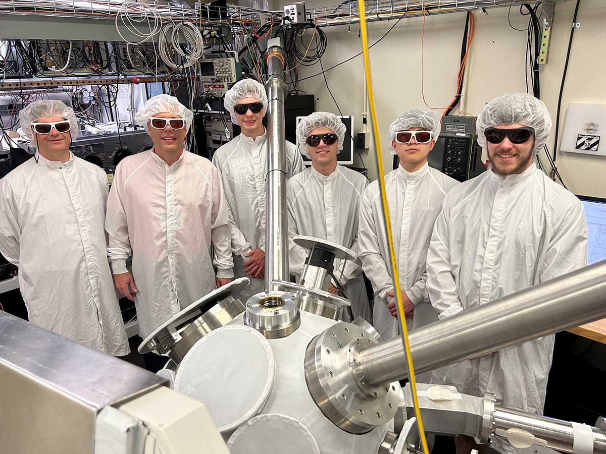 Houghton Universityphysics faculty and students in lab.