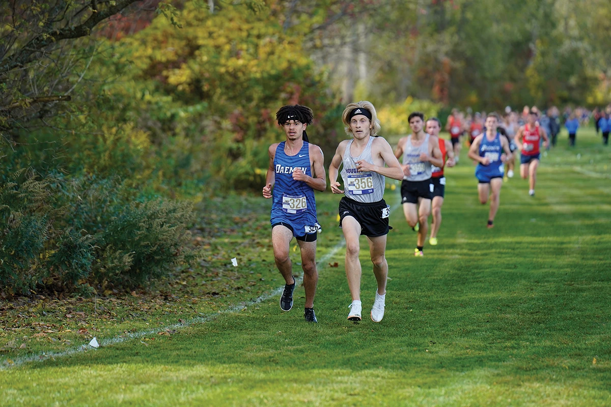 Houghton Universitymen's cross country team competing during track meet.
