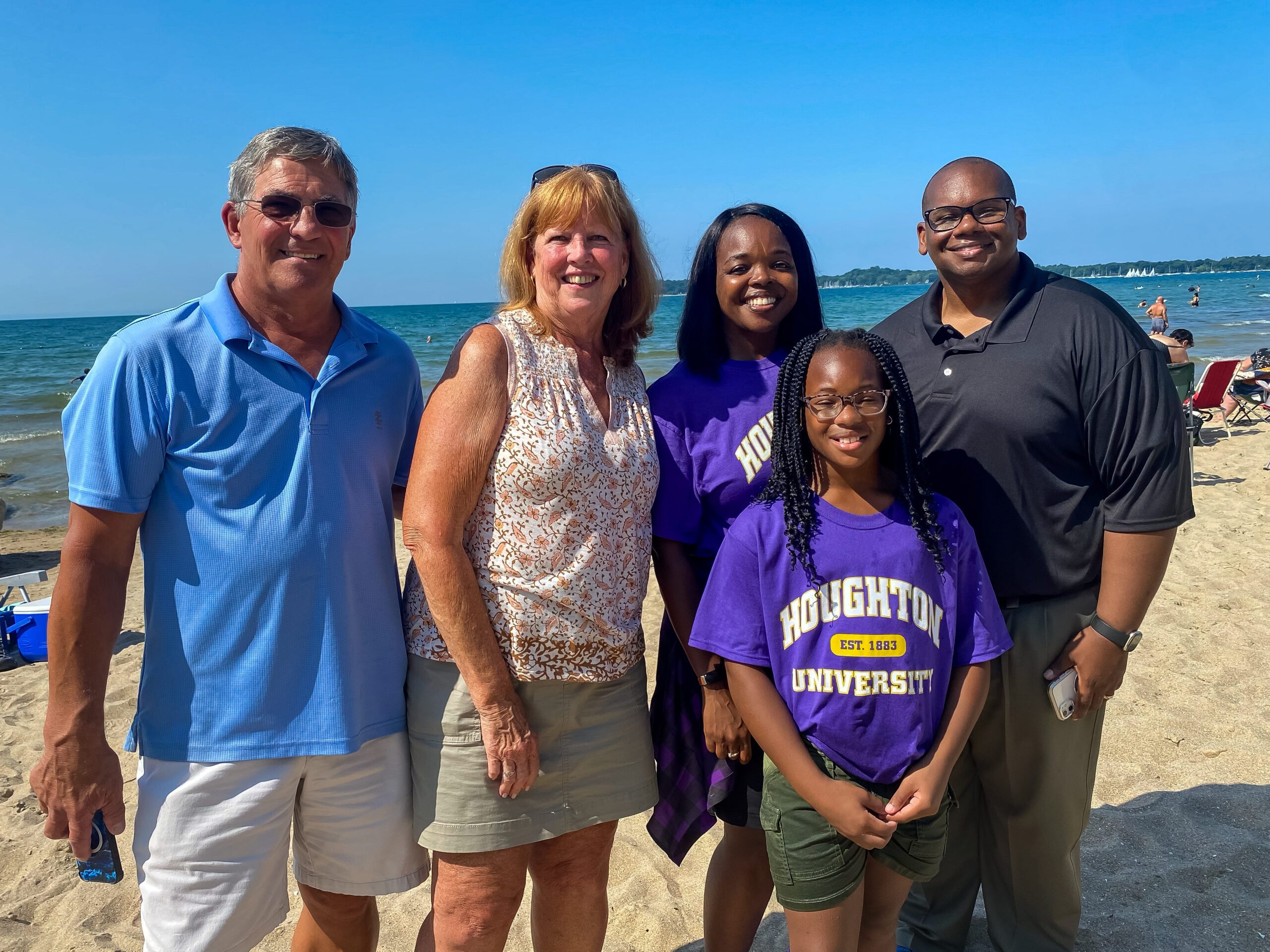 Lewis family with attendees at church on the beach