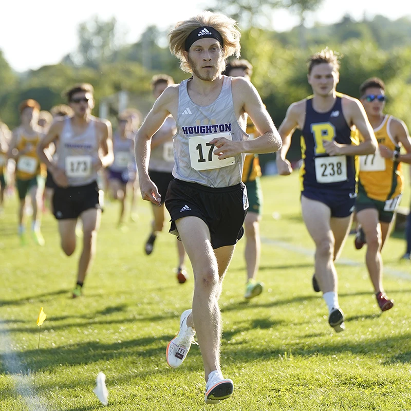 Houghton Universitytrack athlete Caleb Kasper running race.