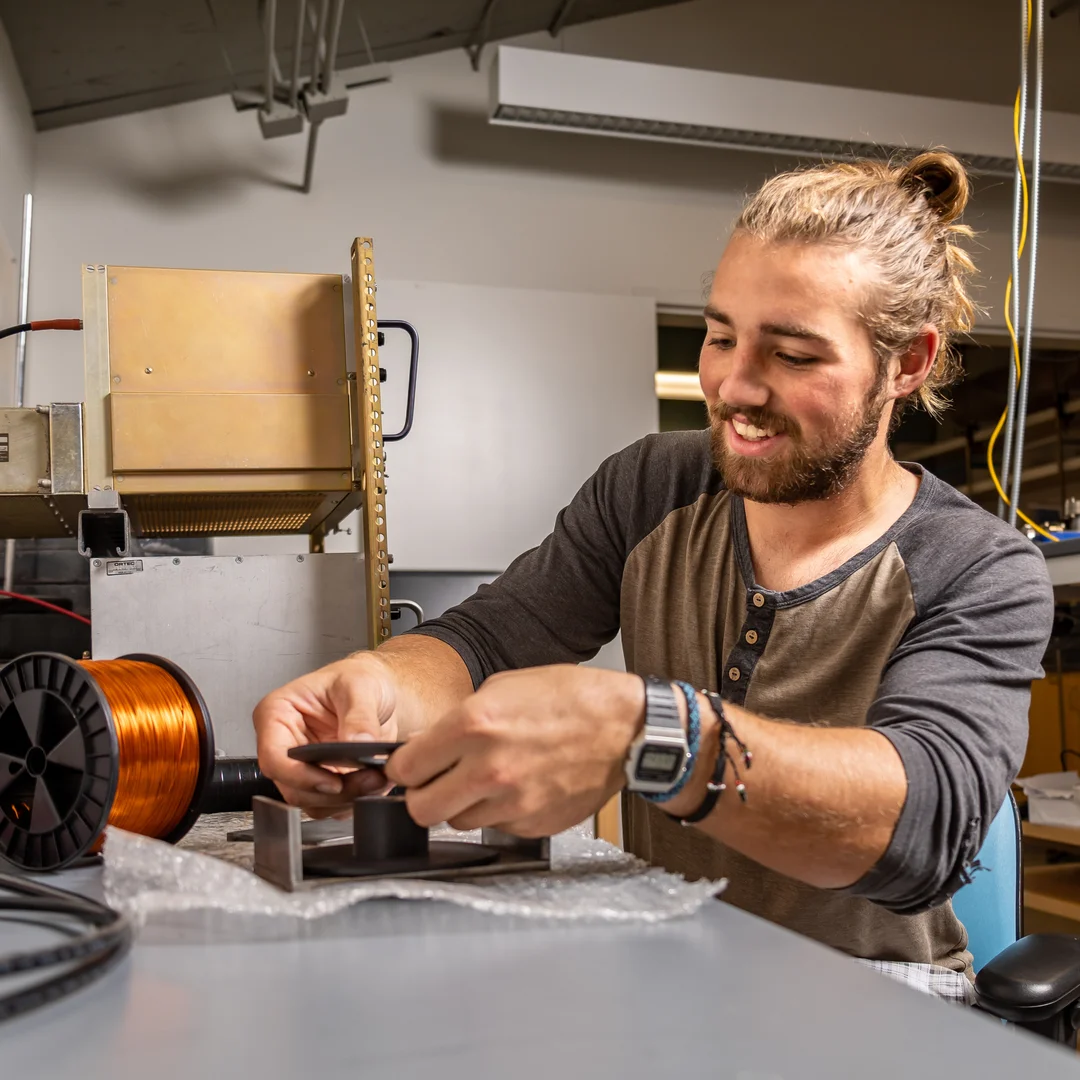 Houghton UniversityApplied Physics student working with equipment in lab.