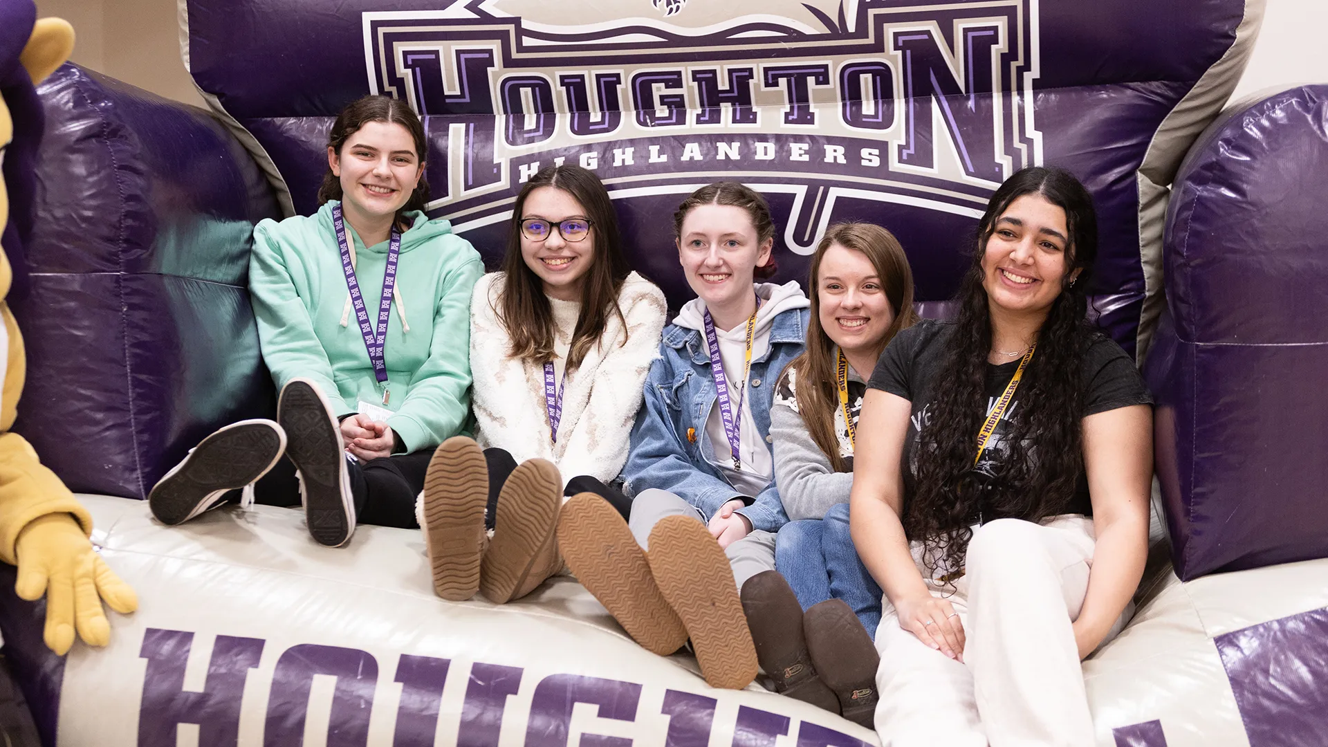 Five future ����ר�� students sitting on large inflatable chair at Accepted Students Day.
