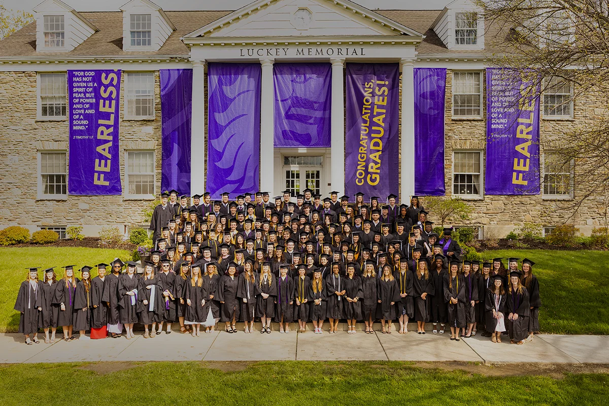 Houghton Universityclass of 2024 standing in front of Luckey Memorial.