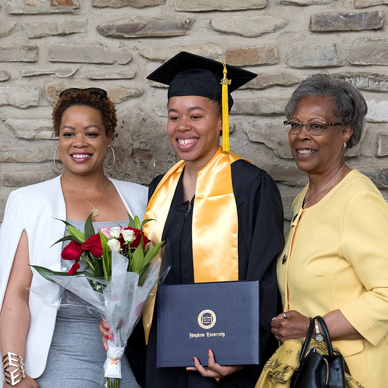 Houghton Universitygraduate with their family.