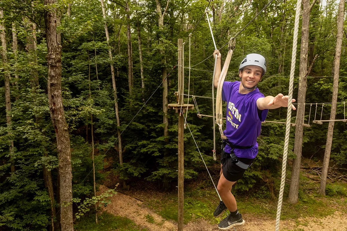 Houghton Universitystudent on EPIC Adventures high ropes course.