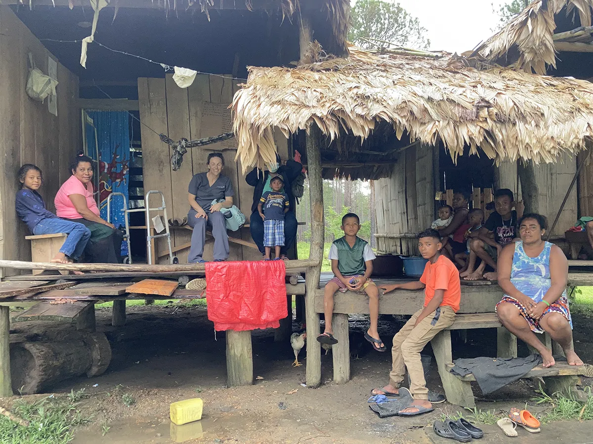 Houghton Universityalumna Lynne Orozco in Honduras with local citizens.