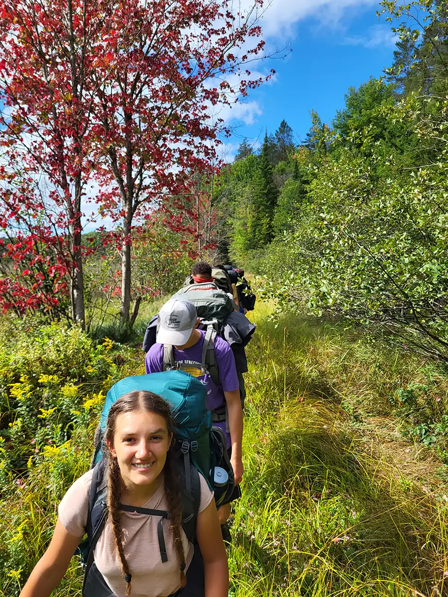 Houghton UniversityHighlander Wilderness Adventure students hiking on path.