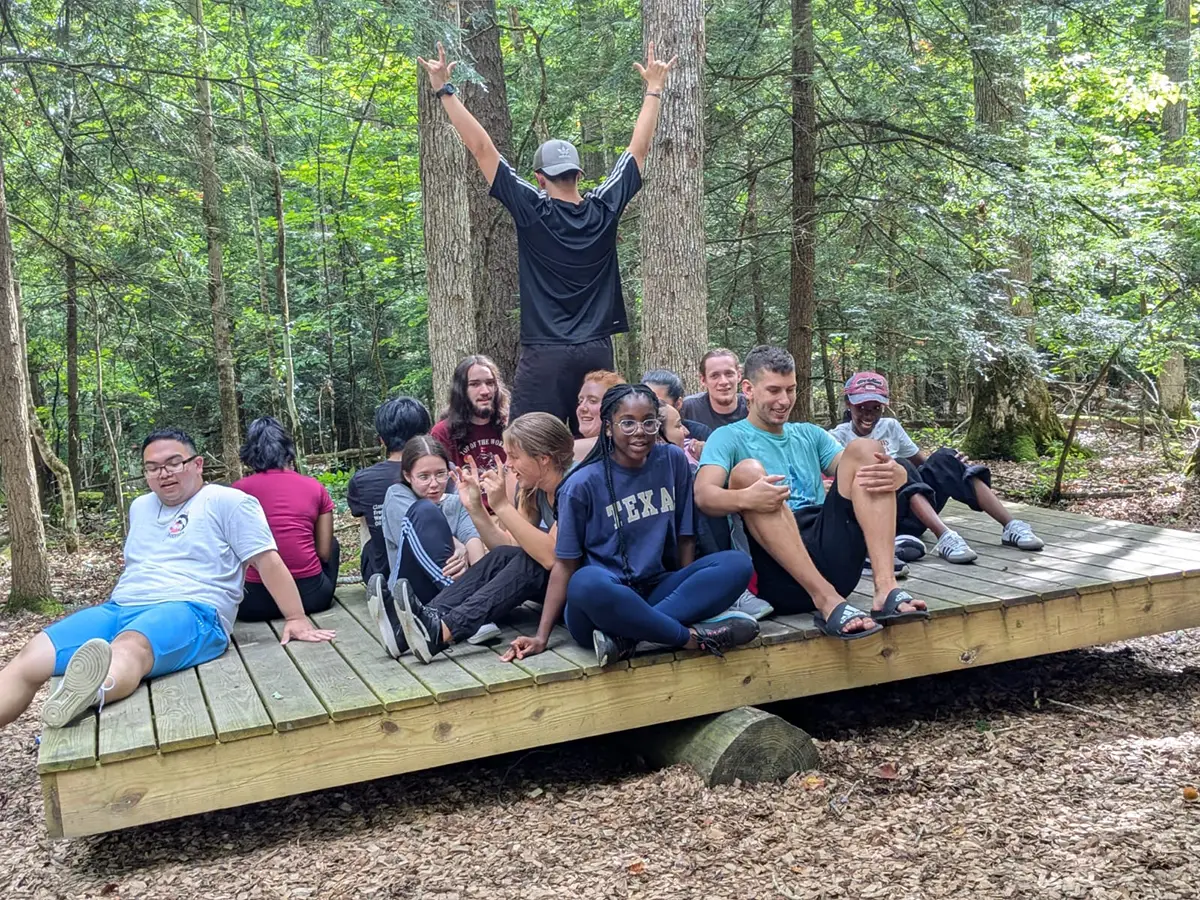 Houghton Universityinterconnect students working teeter tauter group challenge.