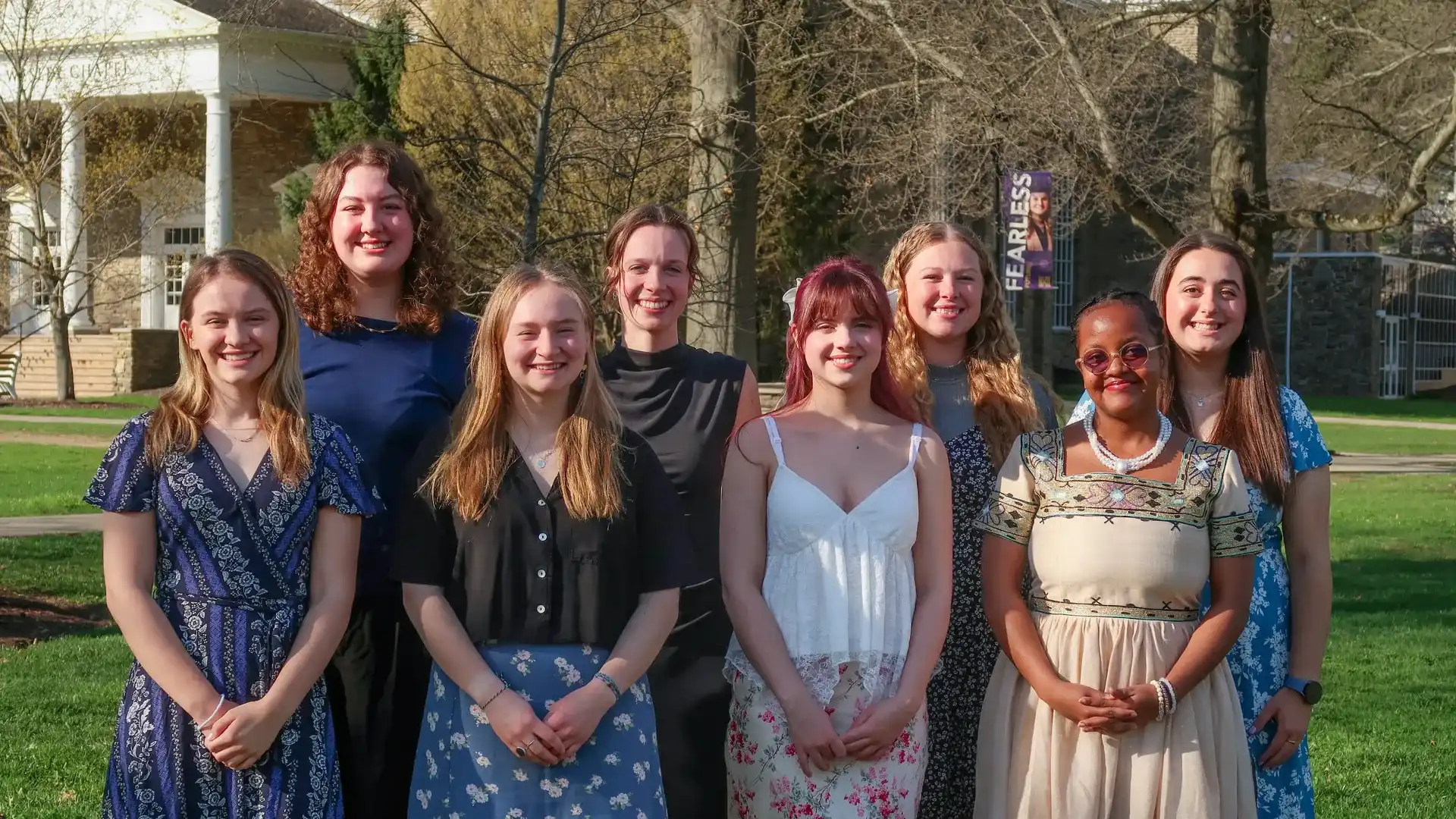 ����ר��'s newest 8 students to be added to Psi Chi standing on quad.