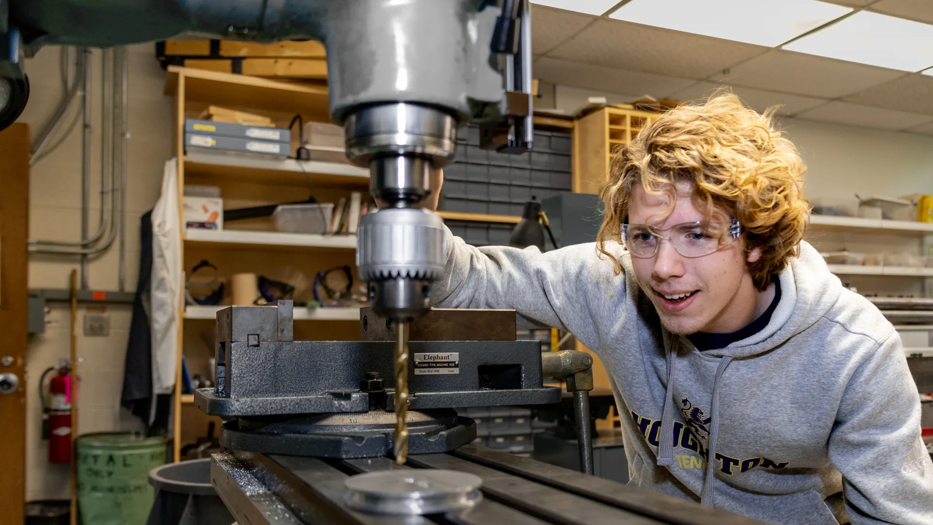 Houghton University student in physics lab.