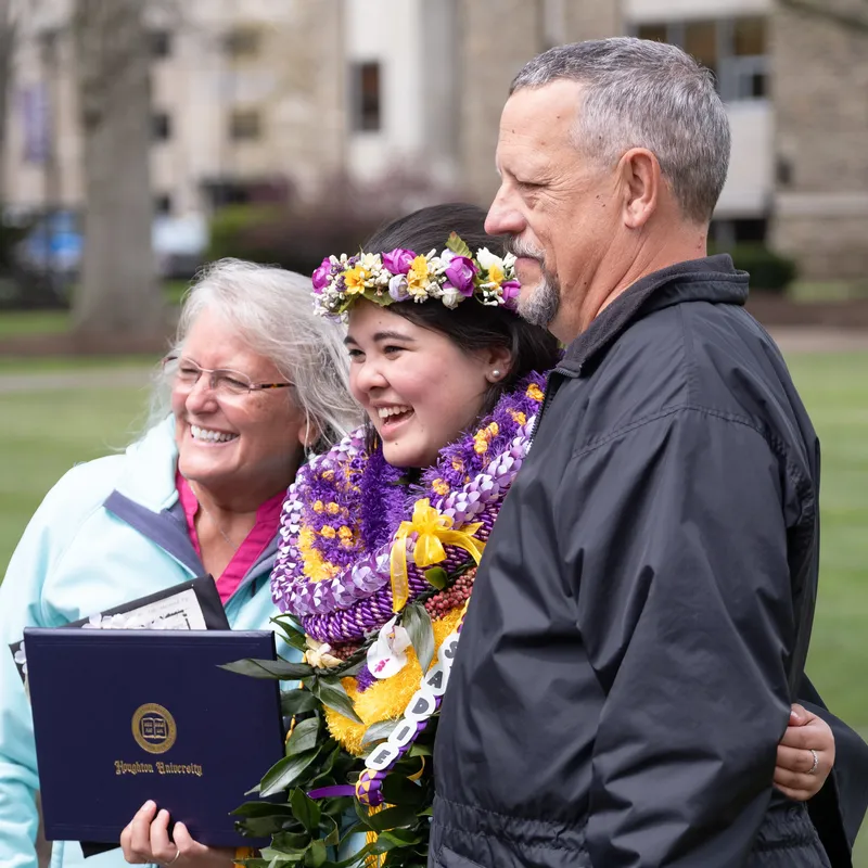 Commencement 2026 students and family outside on the quad