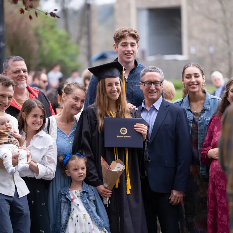 Commencement 2026 students and family outside on the quad