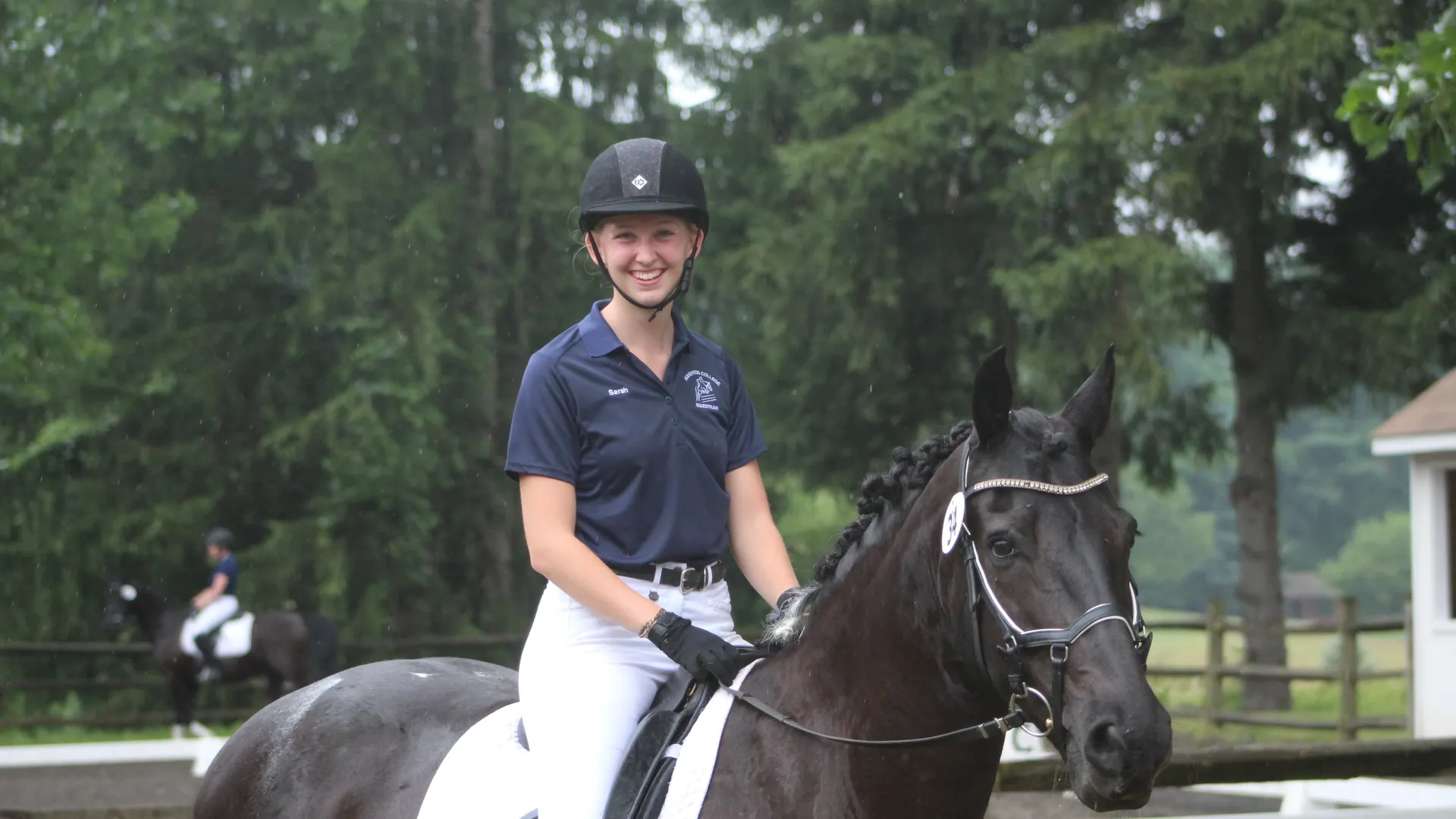 Student riding otto the horse outside