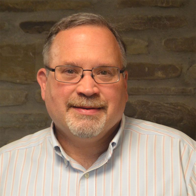 Kurt Habecker with stripe button up shirt.