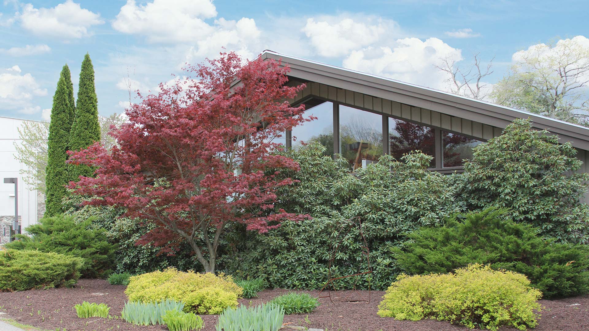 Stevens Art Studio at Houghton College with partly cloudy skies.