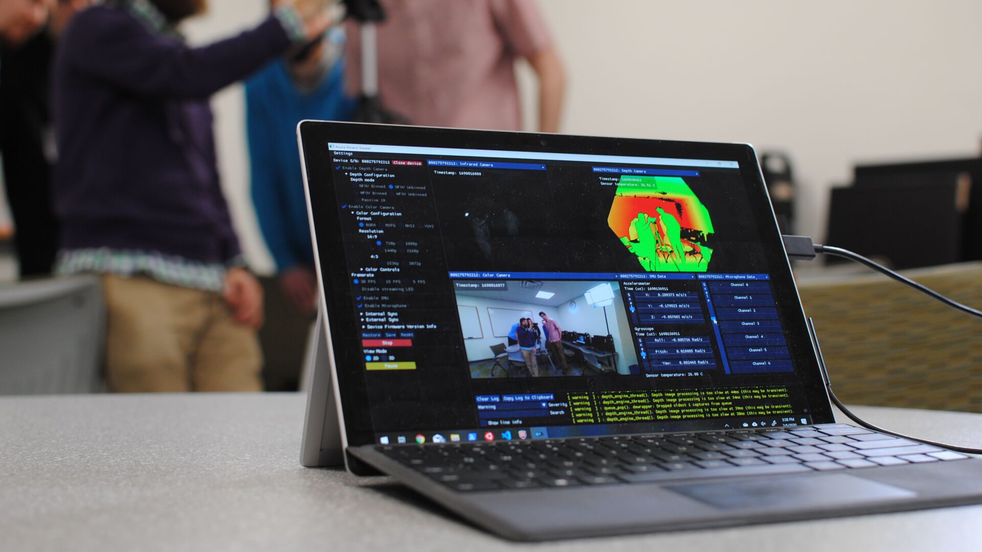 Open laptop with images and graphics on the screen in Data Science class.