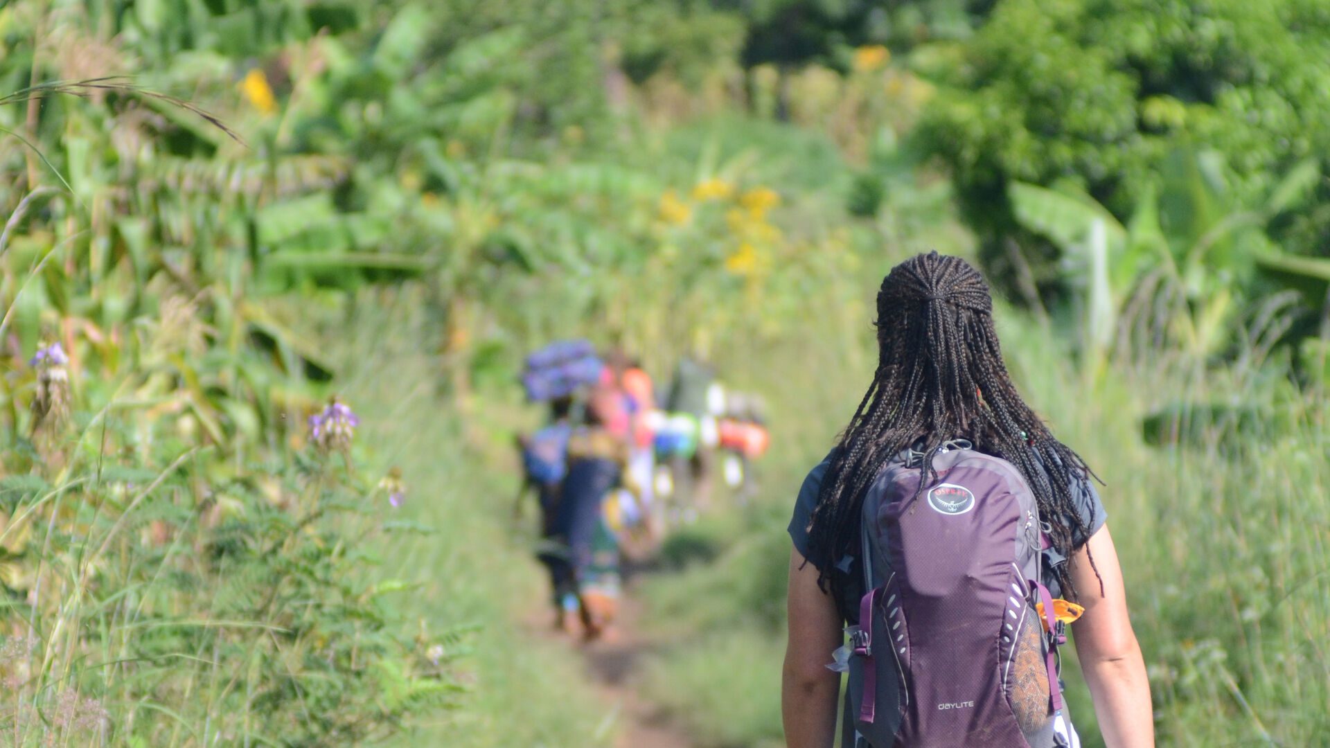 Houghton student walking down first path following Tanzanians.