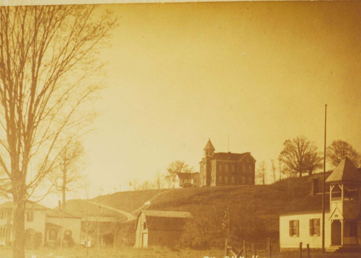 Historic sepia photo of some of the original buildings on Houghton's campus.
