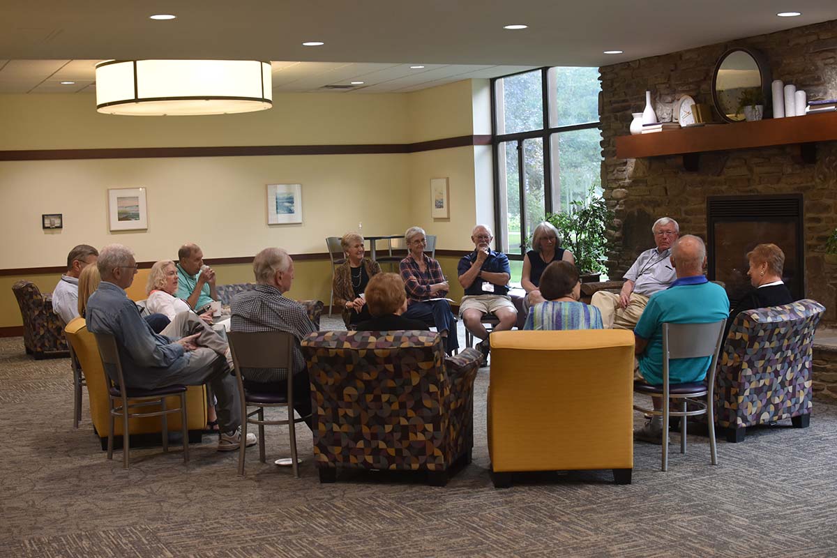 Group of alumni sitting together in the campus center.