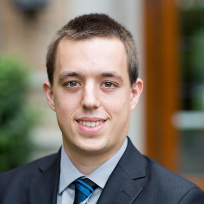 Daniel Hammer in suite coat and tie.