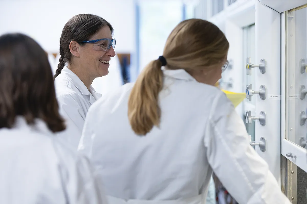Houghton chemistry professor Dr. Karen Torraca working with students in lab.