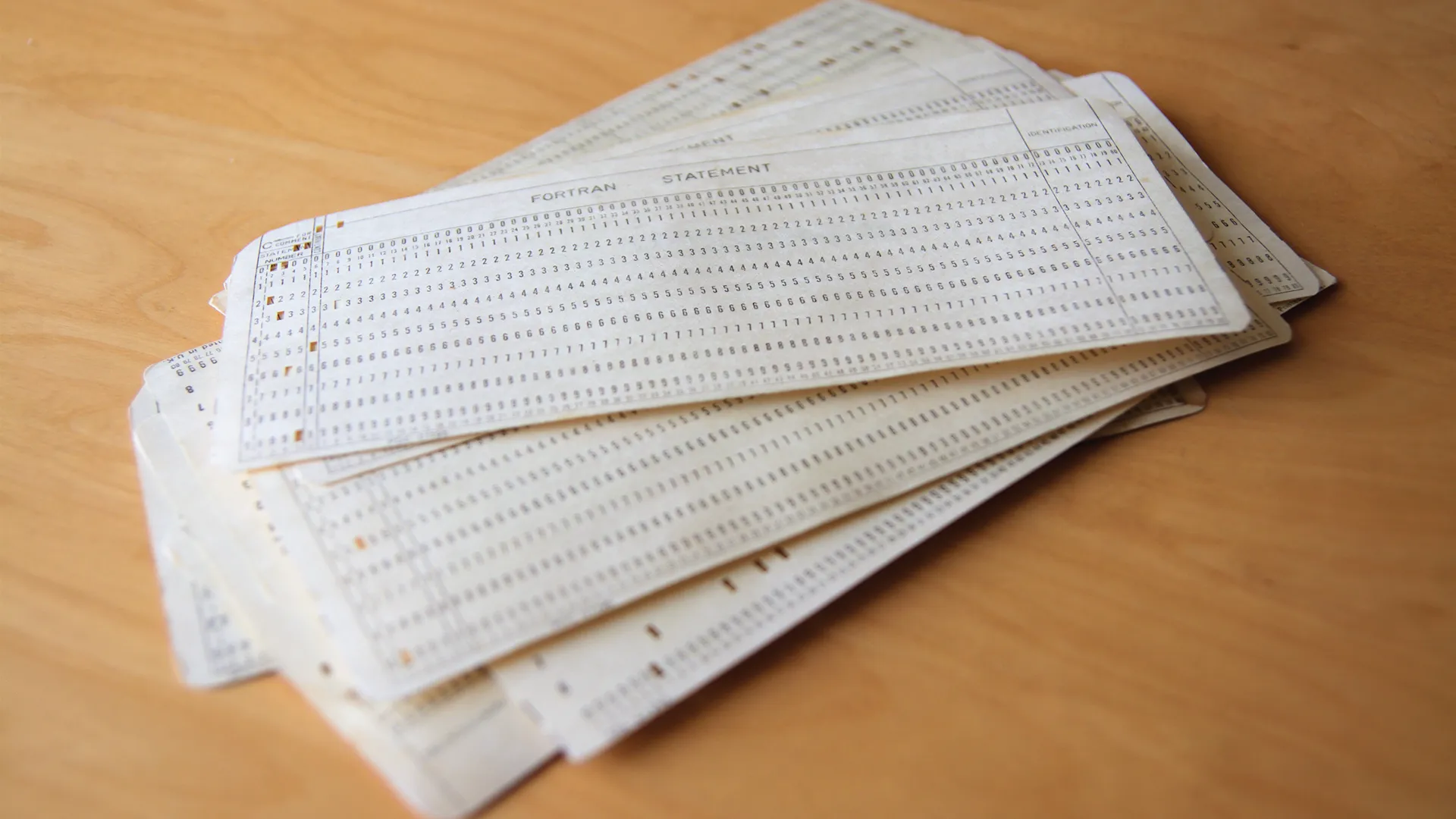 Pile of punched cards on table.