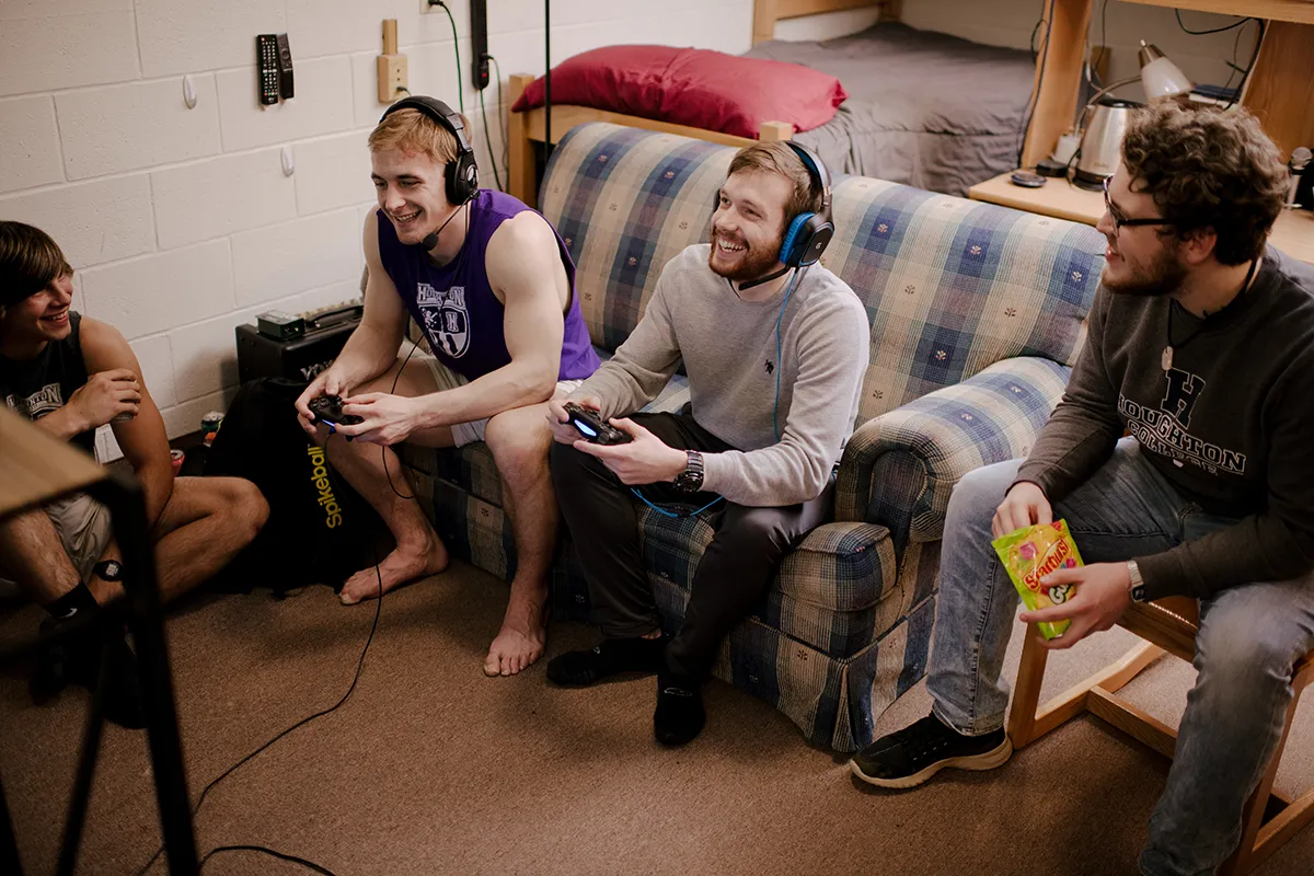 Houghton students hanging out playing video games in Shenawana Hall.