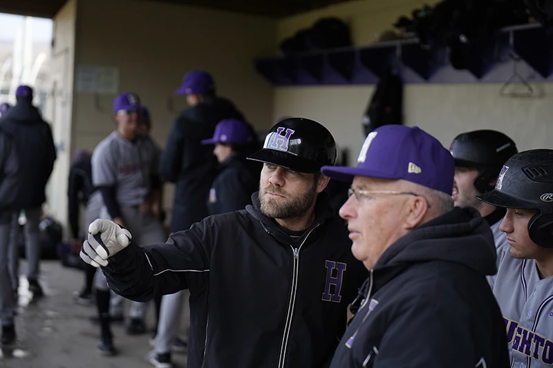 Houghton baseball coach Brian Reitnour in baseball dugout.